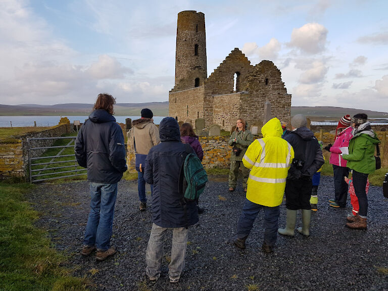 Sarah Jane gives a talk in front of St Magnus Kirk in Egilsay.