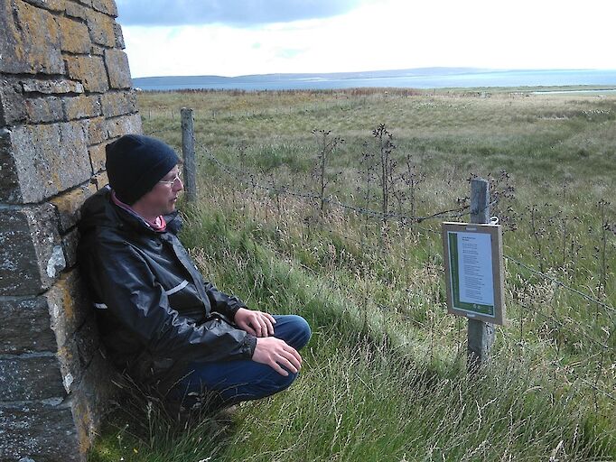 A pilgrim, Christopher Gee, reflecting on George Mackay Brown's poem. Memorial cairn, Egilsay.